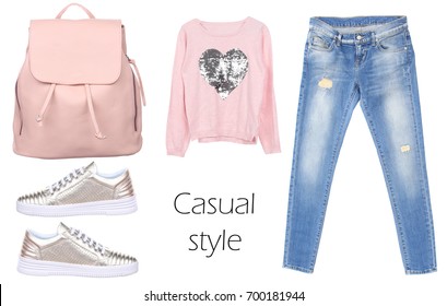 Outfit of casual woman. Jeans, leather backpack, silver sneakers, pink pullover isolated on white background. Top view. Pale colors fashion set - Powered by Shutterstock