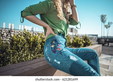 Outfit Details Of Woman Wearing Jeans With Embroidery 