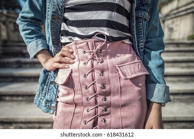 Outfit Details Of Woman's Skirt With Laces, Striped T-Shirt And Denim Jacket