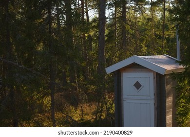 Outhouse on the side of forest