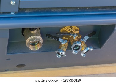 Outlet ball valves on an air compressor close-up.