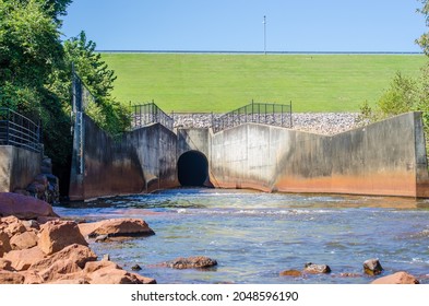 The outlet spillway on Falls Lake Dam providing outlet for the controlled release of overflow water from the intake tower into the Neuse River regulating the depth of the water behind the earthen dam.
