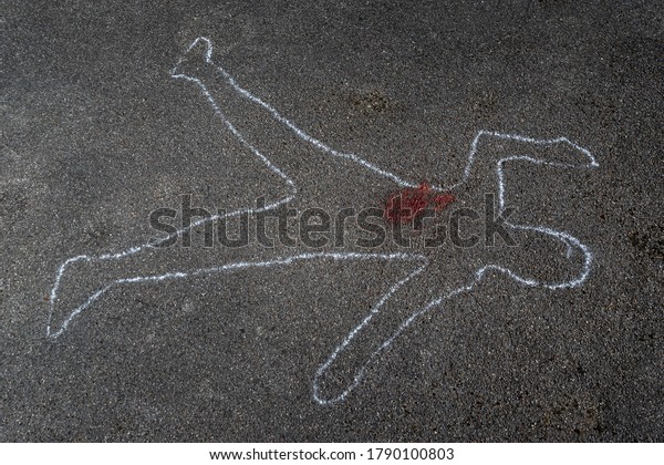 outline of a body on\
asphalt
