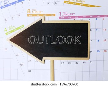 Outlook Word On The Calendar In Year 2020 The Concept Of Economic / Business Outlook In Future.   