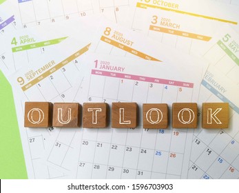 Outlook Word On The Calendar In Year 2020 The Concept Of Economic / Business Outlook In Future.   