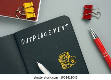  OUTPLACEMENT inscription on the page. Outplacement is any service that assists a departing employee with obtaining a new job or transitioning to a new career