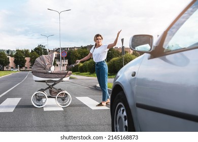 Outraged mother with the baby pram conflicting with a car's driver on the crosswalk. Concepts of safety and traffic code. - Powered by Shutterstock