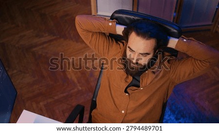 Outraged software engineer perplexed by impossible to remove bugs appearing while coding on computer desktop. Teleworking IT admin feeling baffled by script errors, putting hands on head.