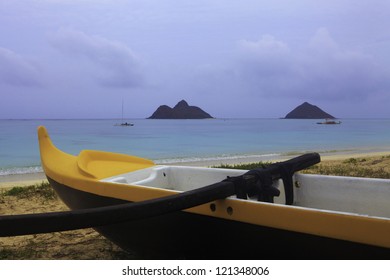 Outrigger Canoe On The Beach In Hawaii At Dusk