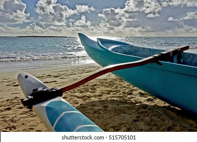 Outrigger Canoe On Sandy Beach In Hawaii At Sunrise 