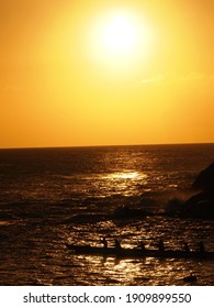 Outrigger Canoe Paddling At Sunset