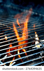 Outside BBQ Grill With Bright Flames And Glowing Coals ready for cooking on