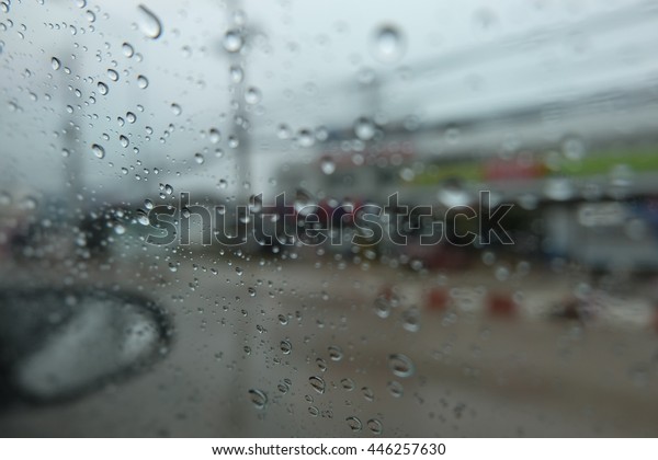 Outside the car in the raining\
day