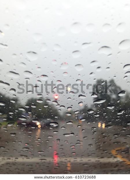 Outside the car in the raining day, View from car\
seat. focus rain