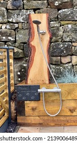 Outside Dog Shower With Wood Background