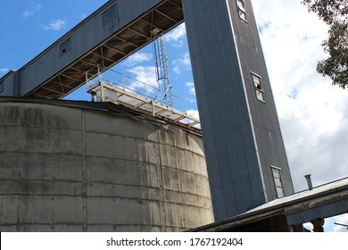 the outside elevator shaft and platform and part view of grain silo