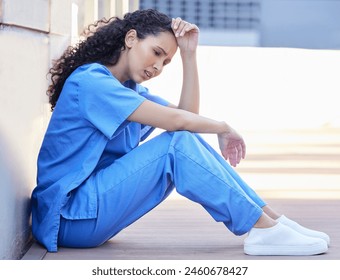 Outside, female nurse and stress, tired and mental health of medical employee outdoor. Exhausted, healthcare worker or woman with migraine or burnout, anxiety and overworked pressure in balcony - Powered by Shutterstock