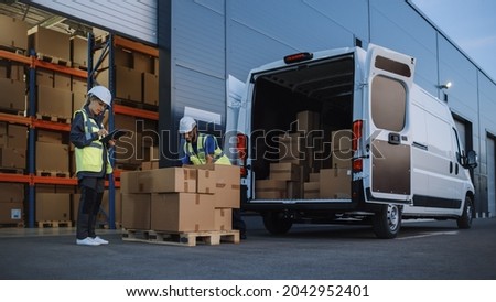 Outside of Logistics Distributions Warehouse With Inventory Manager Using Tablet Computer, talking to Worker Loading Delivery Truck with Cardboard Boxes. Online Orders, Purchases, E-Commerce Goods