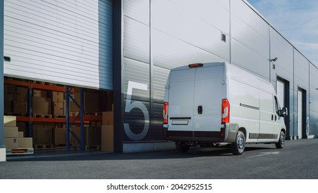 Outside Of Logistics Retailer Warehouse With Manager Using Tablet Computer, Workers Start Loading Delivery Truck With Cardboard Boxes. Online Orders, Purchases, E-Commerce Goods. High Angle Shot