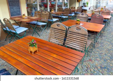 Outside Patio Of An European Restaurant - Tables And Chairs On The Street Of Berlin, Germany