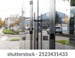 Outside solid glass door with building exterior