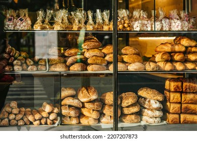 Outside view of the bakery glass showcase. Freshly baked bread, rolls, cookies - Powered by Shutterstock