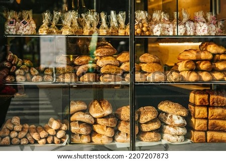 Outside view of the bakery glass showcase. Freshly baked bread, rolls, cookies