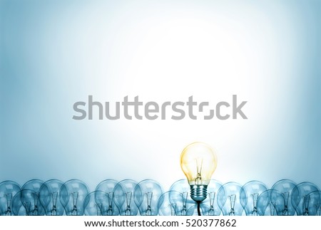 Outstanding creative idea background concept . one Light bulb glowing among a group light bulbs.
