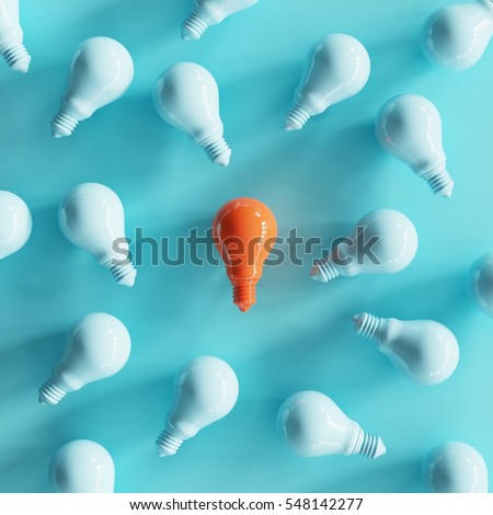 Outstanding Orange light bulb color in middle Surrounded by blue light bulb. minimal concept.