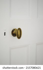 An Oval Brass Door Knob And Lock 