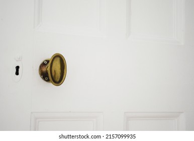 An Oval Brass Door Knob And Lock 