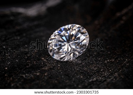 Oval cut diamond on black coal