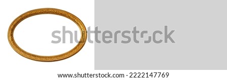 Oval empty transparent wooden and gold gilded ornamental frame, isolated on white background