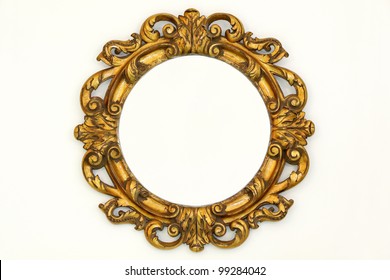 Oval Gold Baroque Style Frame On Beige Wall