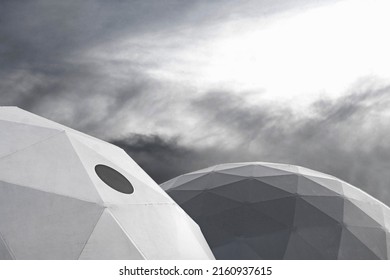 Oval Plastic Greenhouse With Triangle Pattern Looking Like Space Exploration Center. Garden Center With Black Window Surrounded With Stormy Clouds. 