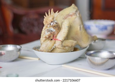 Oval Plate With A Whole Chicken Boiled, A Symbol Of Purity And Best Offering To Ancestors During Tet And Other Spiritual Occasions In Vietnam