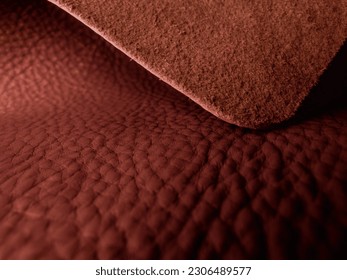 An oval-cut brown leather piece, symbolizing leather craftsmanship, with both the front and back surfaces visible. A unique concept for luxury products. - Powered by Shutterstock