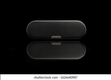 Oval-shaped Bluetooth Speaker With A Black Scene