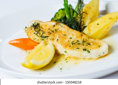 Oven Baked Antarctic Snow Fish Flushed With A Butter, Lemon And Rosemary Sauce