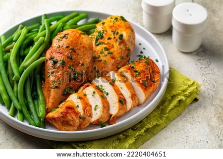 Oven baked boneless chicken breast made with paprika and parsley,  green beans. Healthy eating concept. Сток-фото © 