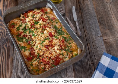 Oven Baked Fish Dish With Redfish, Tomatoes, Onion,  Feta Cheese, Olive Oil And Parsley. Greek Recipe Psari Plaki