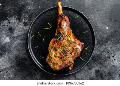 Oven baked lamb leg. Dark background. Top view - Shutterstock ID 1836788362