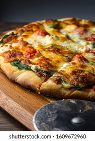 Oven Baked Vegetarian Pizza On Wooden Pizza Peel