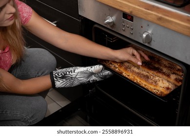 Oven Baking Deliciously Tasty Homemade Pizza with Great Care and Attention to Every Detail - Powered by Shutterstock