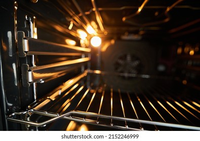 Oven In The Oven Close-up. Inside A New Empty Electric Open Oven With Light. 