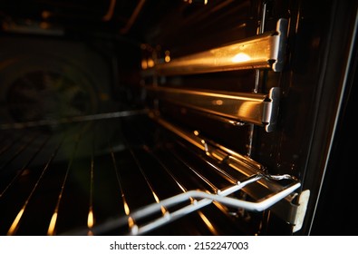 Oven In The Oven Close-up. Inside A New Empty Electric Open Oven With Light. 