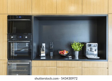 Oven And Coffee Machine In Modern Kitchen