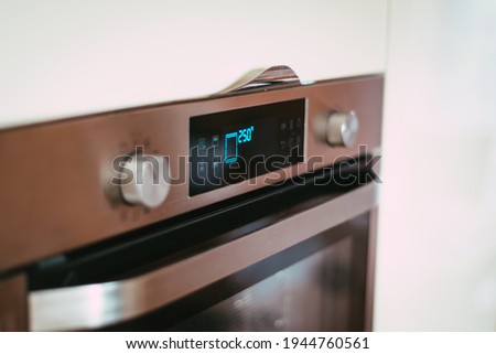 oven in the kitchen heated to a high temperature of 250 degrees Celsius - kitchen equipment