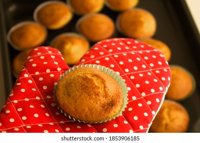 Oven Mitt Holding A Hot Cupcake