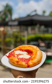 Oven Pizza With Tomato Sauce And Mozzarella Photographed Outside A Bar